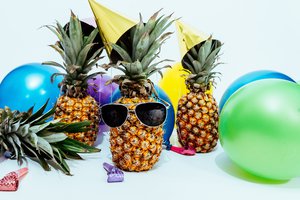 photo-of-three-pineapples-surrounded-by-balloons-1071882.jpg